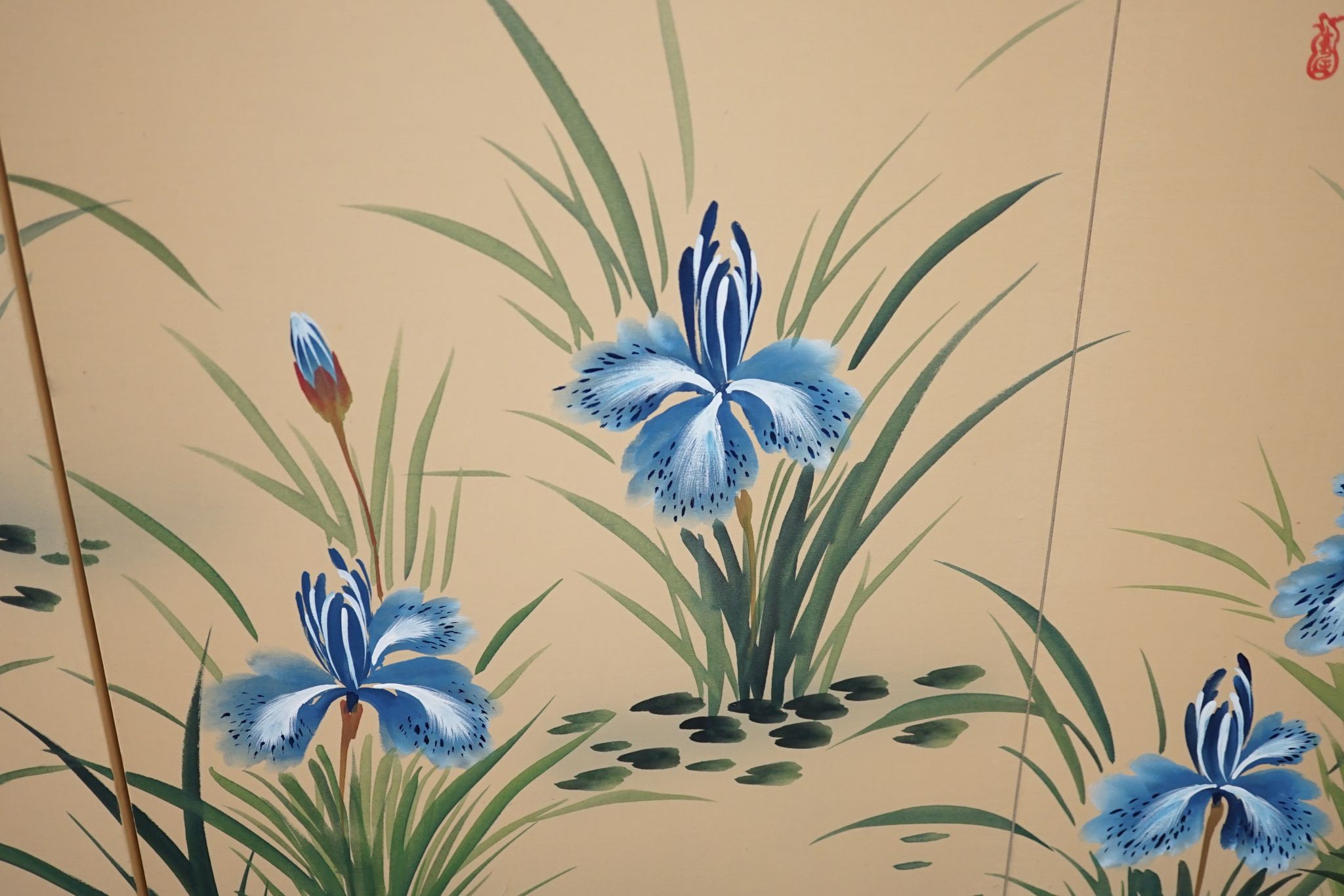 A Japanese painted silk four-fold screen, 152cm full width